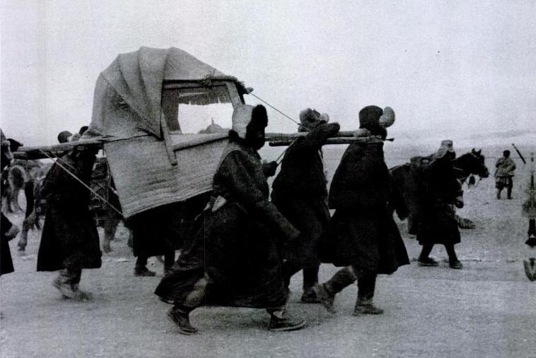 Dalai Lama's sedan chair being carried by servants