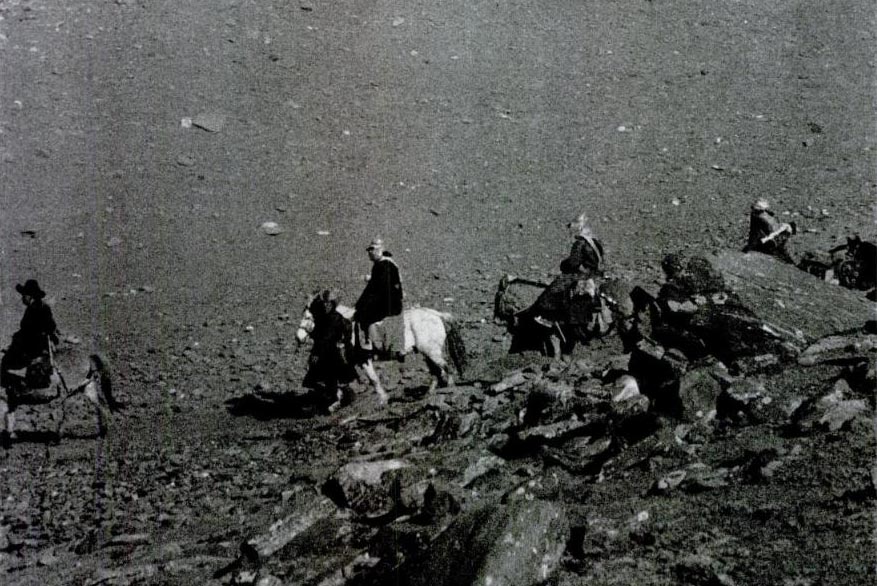 Dalai Lama riding a white horse on his journey from Lhasa