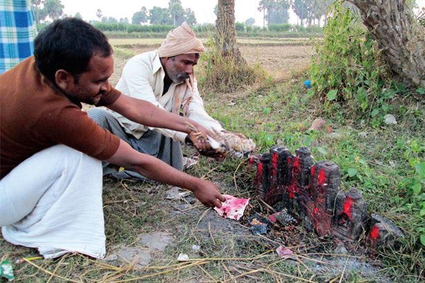 Villagers offer a sacrifice at Goraiya Sthan