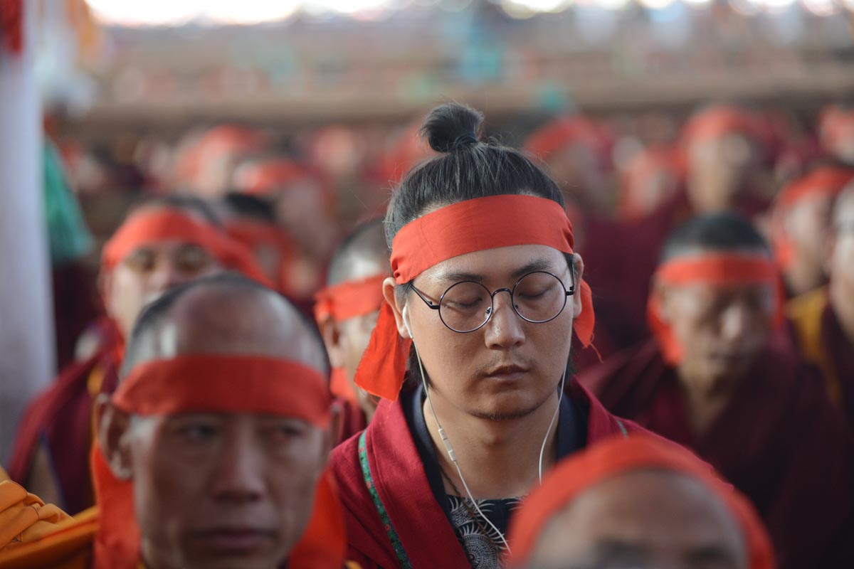 Devotees listen to the Dalai Lama during the Kalachakra Empowerment in Bodh Gaya, India, on 13 January 2017.