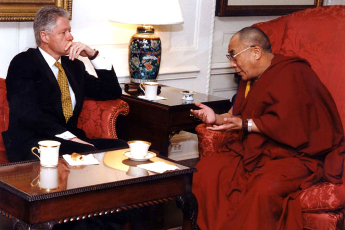US President Bill Clinton listens to the Dalai Lama during a meeting at the White House in Washington DC, on 10 November 1998.
