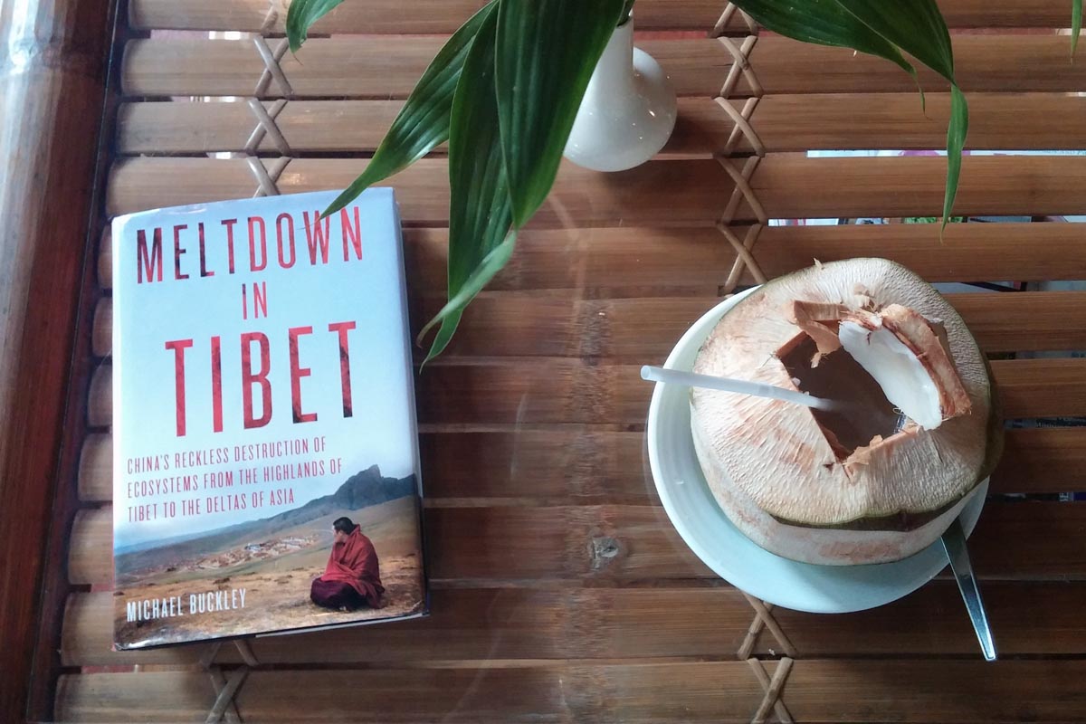 Michael Buckley's book Meltdown in Tibet, shown in a setting from Tibet's downstream ecology.
