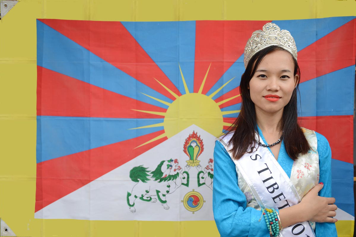 Miss Tibet 2015 Pema Choedon with Tibetan flag.