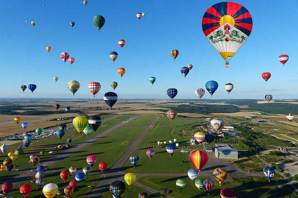 Tashi Gyaltsen, in the Tibet Balloon, flies in the skies of Lorraine, France, where the biggest hot-air balloon gathering in the world is held.