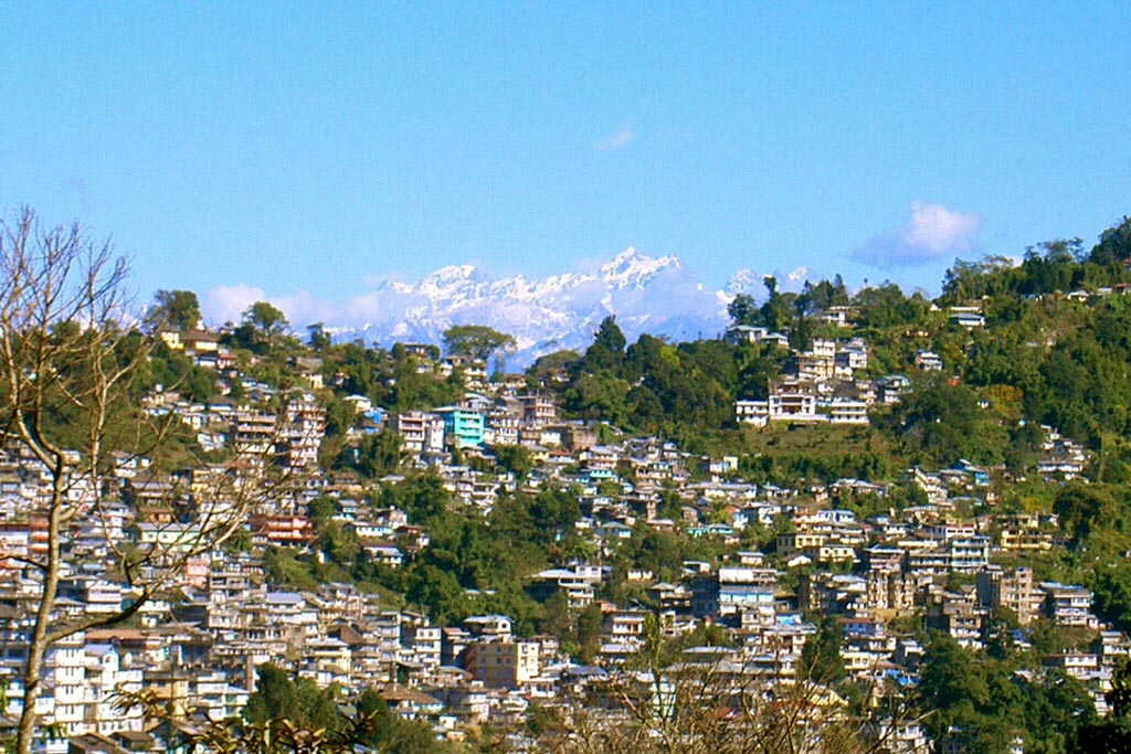 Kalimpong town as viewed from a distant hill. In the background are the Himalayan Mountains.