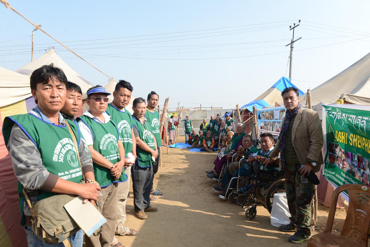 Founding Director Pema Gyalpo (left) and other members of Oshi Shenphen Tsokchung pose for photo at their campsite where they are looking after 26 aged and handicapped people, in Bodh Gaya, India, on 5 January 2017.