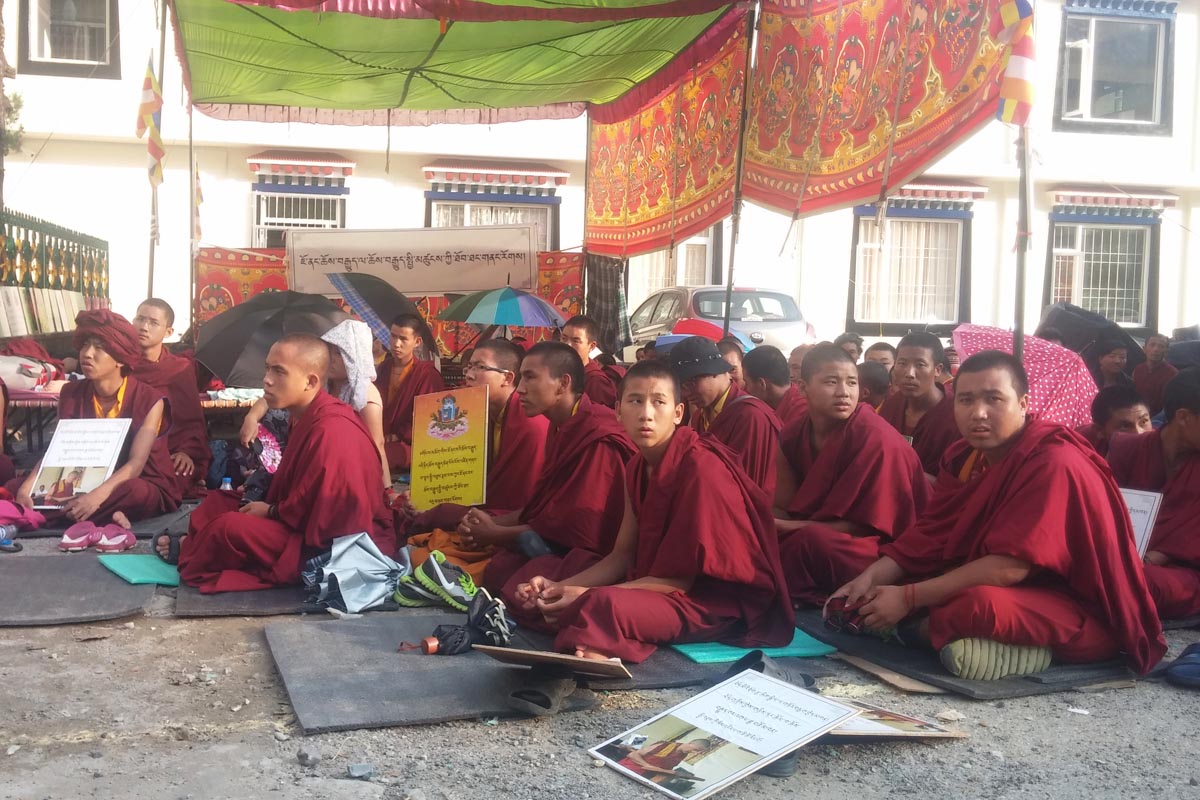 Followers of Jonang tradition sit in protest outside the Tibetan Parliament-in-exile in Dharamshala, India, on 18 September 2015.
