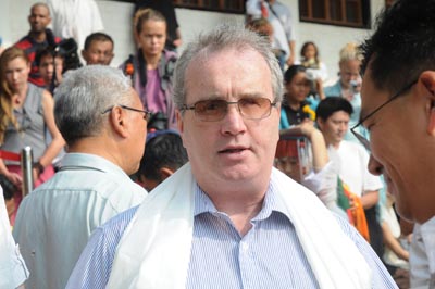 Richard Moore waits for the arrival of the Dalai Lama at the Tibetan Children's Village School