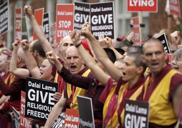 Members of the Western Shugden Society protest as the Dalai Lama arrives at the Royal Albert Hall in London, on 22 May 2008.