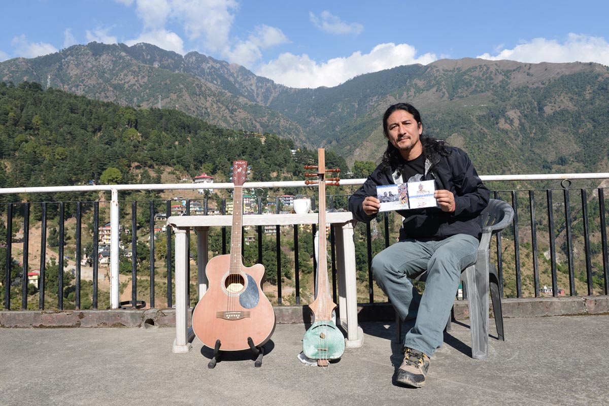 Techung poses for a photo with his new album 'Tashi Sho: Good Luck, Good Life' in McLeod Ganj, India, on 11 November 2015.