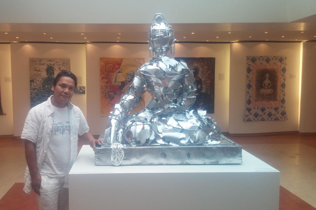 Tashi Norbu stands alongside his art installation in his museum in Emmen, the Netherlands, on 24 July 2017.