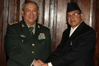 China's army chief General Chen Bingde shakes hands with Nepalese Prime Minister Jhalnath Khanal.