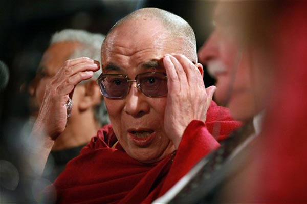The Dalai Lama answers questions during a press conference following his participation in a panel discussion at the World Summit of Nobel Peace Laureates at the Chicago Symphony Orchestra Hall on 25 April 2012 in Chicago, US.