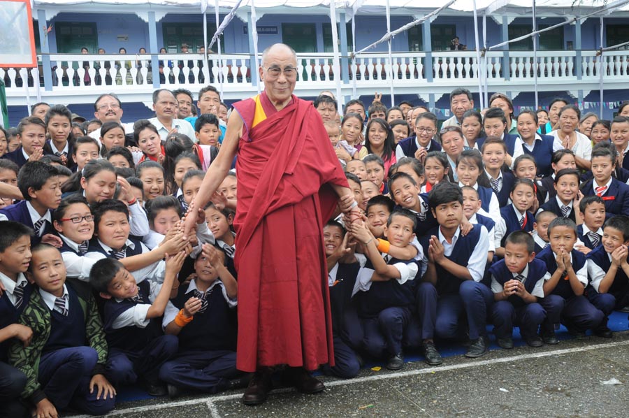 Tibetan spiritual leader the Dalai Lama with students during the 50th anniversary celebration of Tibetan Homes Foundation in Mussoorie, India, on 17 September 2012.