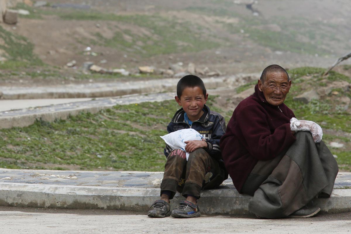 A Tibetan boy and man near Dzamthang Jonang monastery