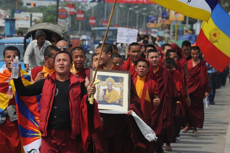 Exiled Tibetan activists shout anti-China slogans during a protest in Siliguri