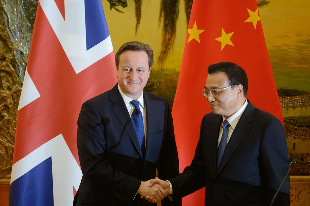British Prime Minister David Cameron shakes hands with Chinese Premier Li Keqiang.