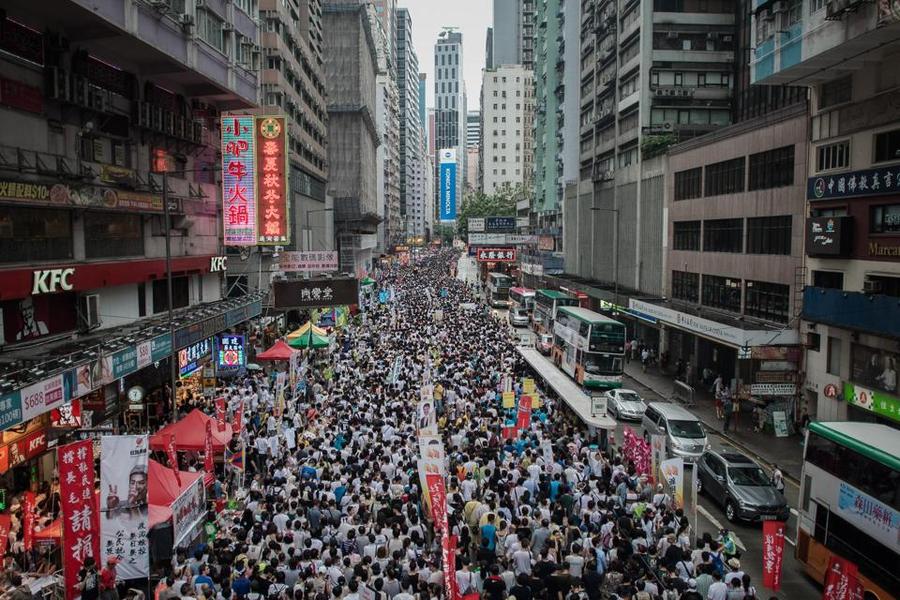 Demonstrators march during a pro-democracy rally in Hong Kong.