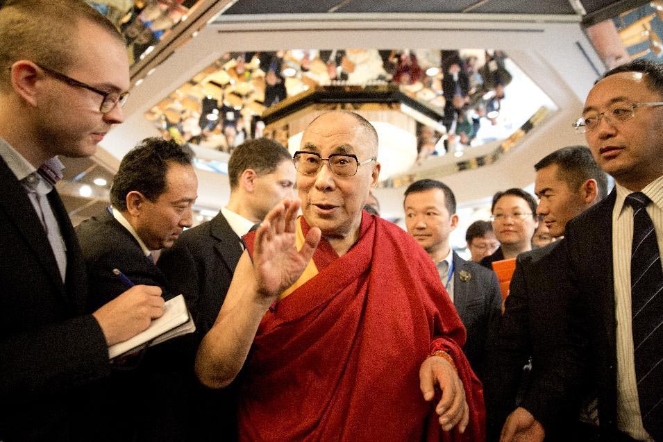 Tibetan spiritual leader Dalai Lama talks with journalists at a Sino-Tibetan conference in Hamburg, northern Germany, on 27 August 2014.