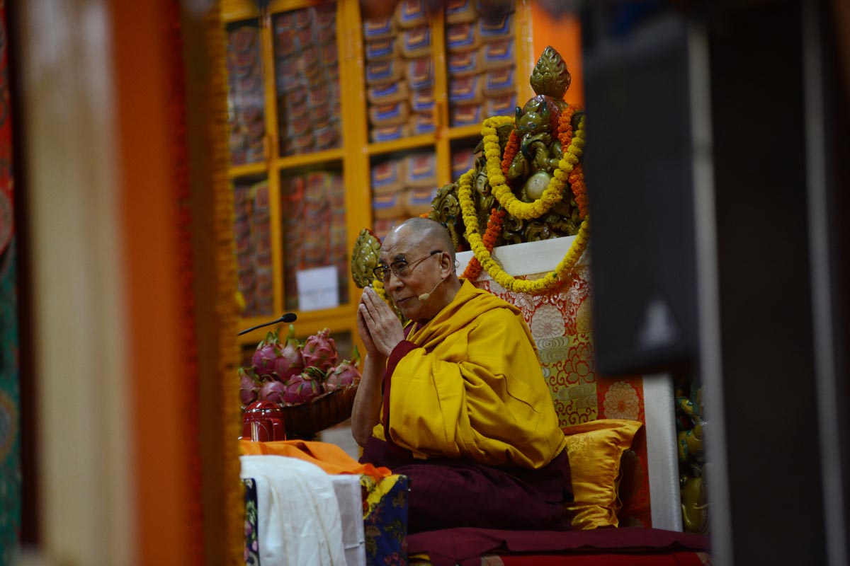 Tibetan spiritual leader the Dalai Lama prays before he begins teaching at Tsuglakhang temple in McLeod Ganj, India.
