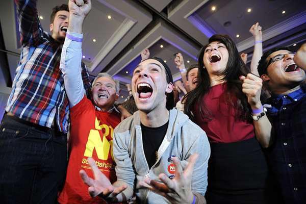 Pro-union supporters celebrate as Scottish independence referendum results are returned at a 'Better Together' event in Glasgow.