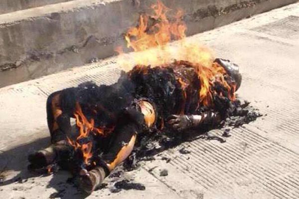 Purported image of 32-year-old monk Kalsang Yeshi's body being consumed in flames on 23 December 2014.