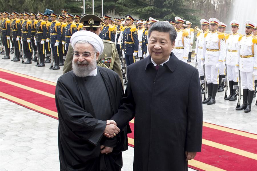 Chinese President Xi Jinping (R) attends a grand welcome ceremony before talks with Iranian President Hassan Rouhani in Tehran, Iran, on 23 January 2016.