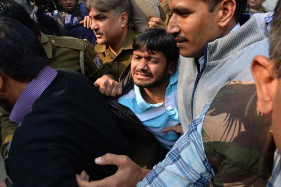 Indian student union leader Kanhaiya Kumar (C) is escorted by police into Patiala Court for a hearing in New Delhi on 17 February 2016.