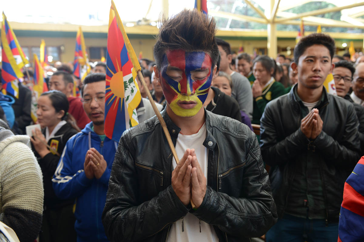 Exile Tibetans pray as they mark the 57th anniversary of the 1959 uprising against Chinese rule in Tibet, in McLeod Ganj on 10 March 2016.