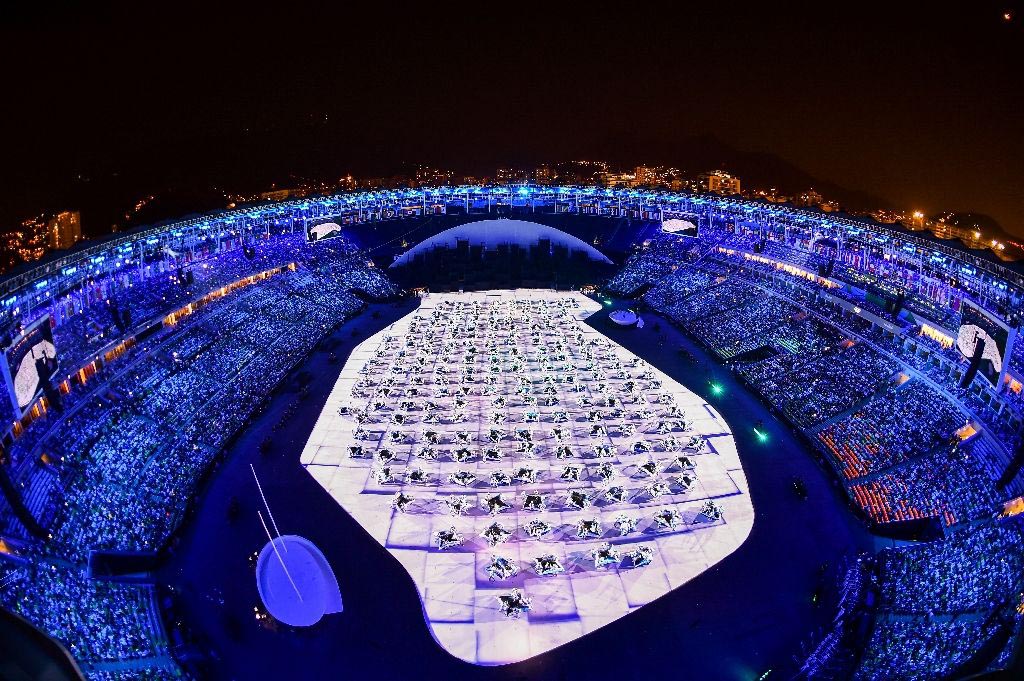 The Maracana stadium lights up in blue during the beginning of the opening ceremony of the Rio 2016 Olympic Games in Rio de Janeiro on 5 August 2016.