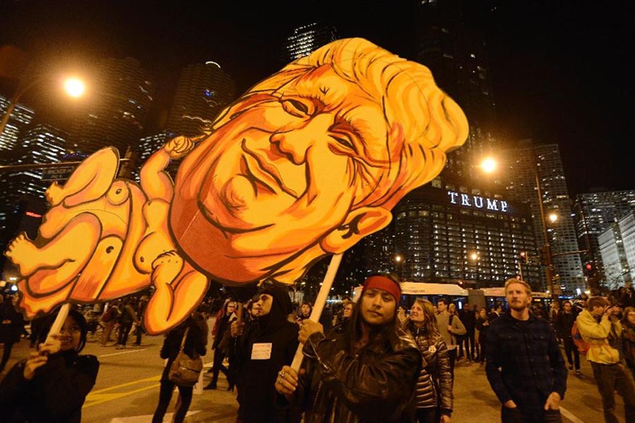 Protests against President-elect Donald Trump were held across the US, gathering thousands in cities including Chicago (pictured), New York and Philadelphia.