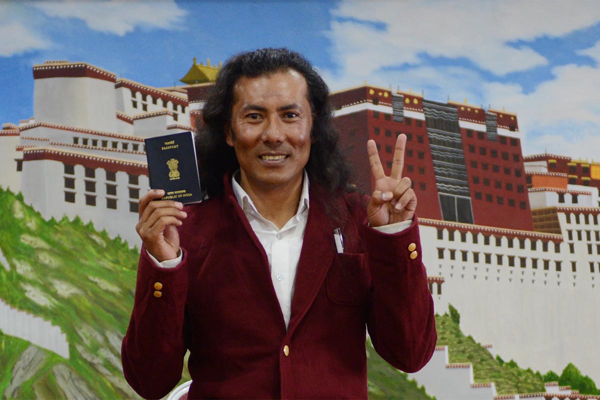Lobsang Wangyal showing his newly-obtained Indian passport during a press conference in McLeod Ganj, India, on 16 March 2017.