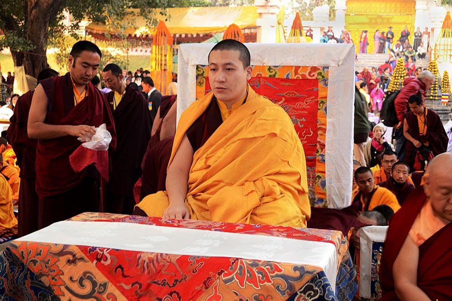 Senior Tibetan lama Thaye Dorje (C) has claimed to be the reincarnation of the Karmapa Lama since childhood, is seen in a file photo taken in Bodh Gaya, India, on 14 December 2013.