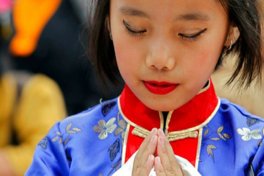 A Tibetan girl offers prayers during celebrations to mark the 82nd
birthday of their spiritual leader the Dalai Lama at a Tibetan camp in
Lalitpur, Nepal, on 6 July 2017.