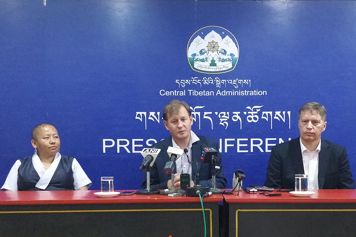 Swedish MP Carl Schlyter speaks during a press conference at the Central Tibetan Administration in Dharamshala, India, on 31 August 2017, while Mattias Bjornerstedt (right), President of the Swedish Tibet committee, and Vice President Jamyang Choedon look on.