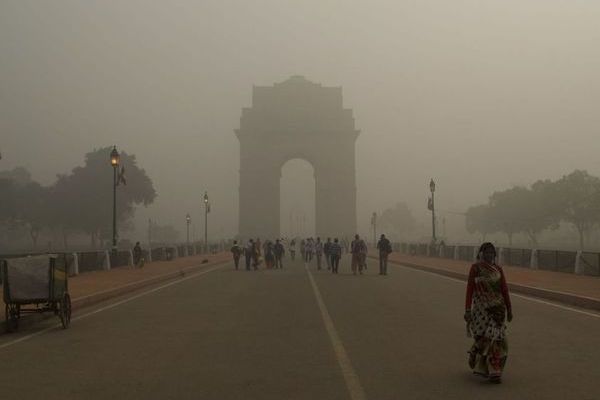 India Gate, a war memorial and one of the iconic monuments of Delhi, is seen dimly through toxic smog on 8 November 2017.
