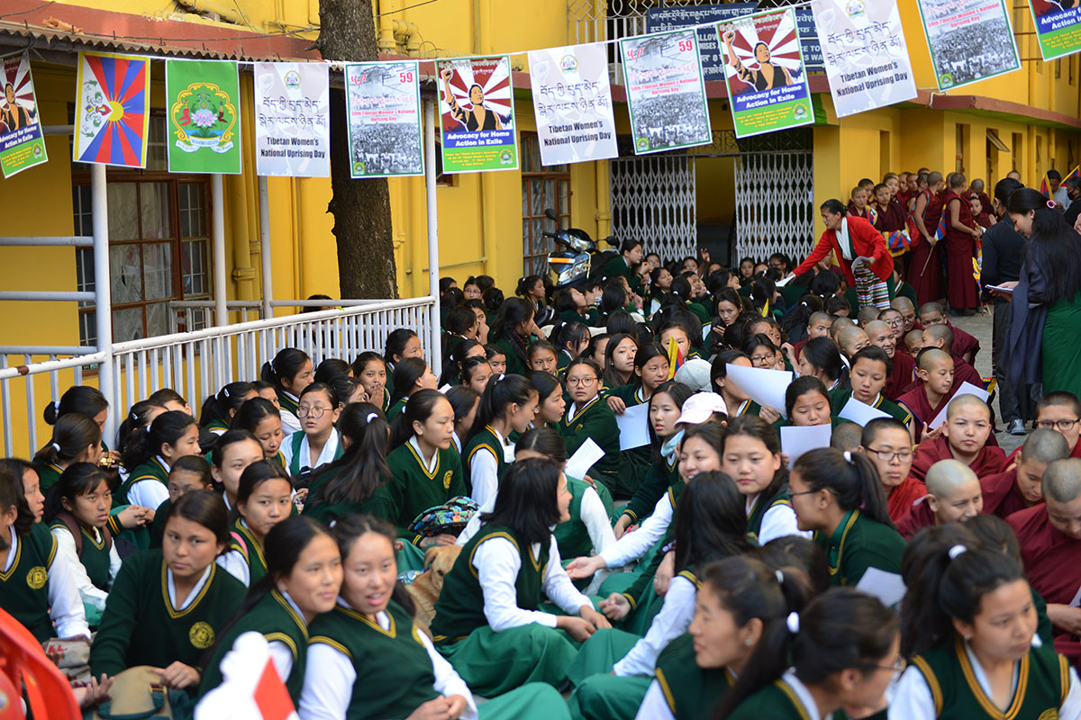 School children wait for the start of the Tibetan Women's Uprising Day function at the Tibetan Martyr's Pillar in McLeod Ganj, India, on 12 March 2018.
