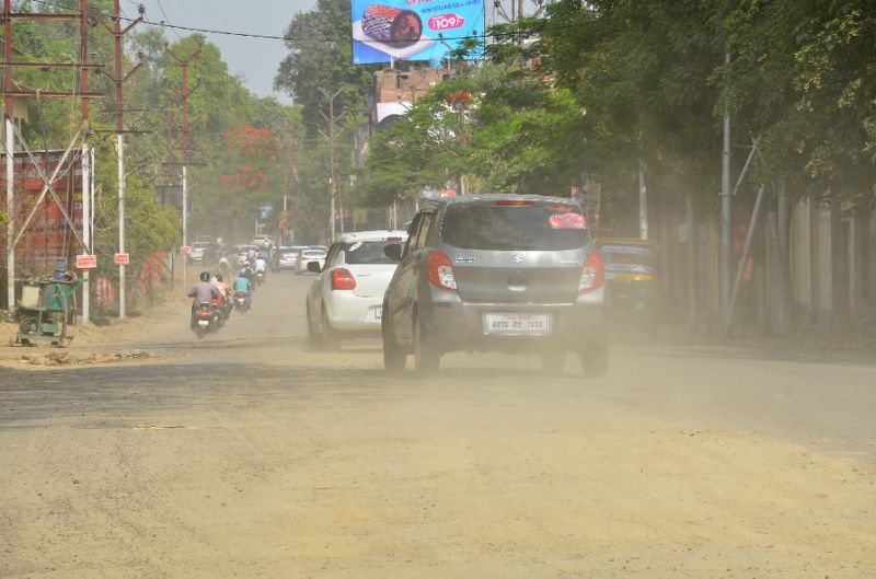Indian commuters drive along a dusty road in Kanpur, judged to have the worst air pollution in a WHO global list of cities.