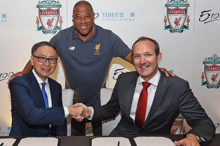 Sunny Wong, executive director of Tibet Water Resources Ltd, and Billy Hogan, chief commercial officer and managing director at Liverpool Football Club, during the signing of their partnership on 24 July 2017.