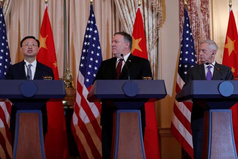 US Secretary of State Mike Pompeo and Defense Secretary James Mattis listen to Chinese Communist Party Office of Foreign Affairs Director Yang Jiechi speak as they hold a joint press conference after participating in a second diplomatic and security meeting at the US Department of State, Washington, US, on 9 November 2018.