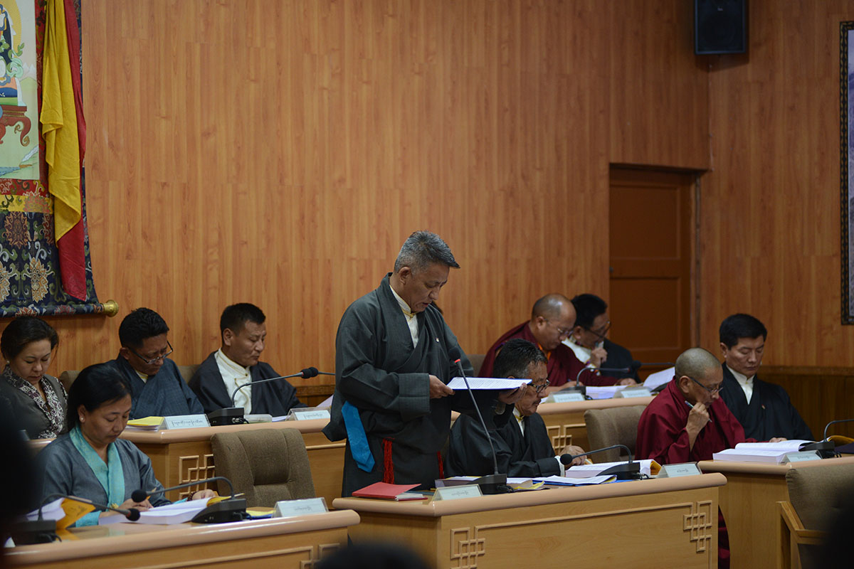 Minister of Finance of the Central Tibetan Administration, Karma Yeshi, presents the 2019-20 budget in the Tibetan Parliament-in-exile in Dharamshala, India, on 19 March 2019. President of CTA Lobsang Sangay is seen on far right.