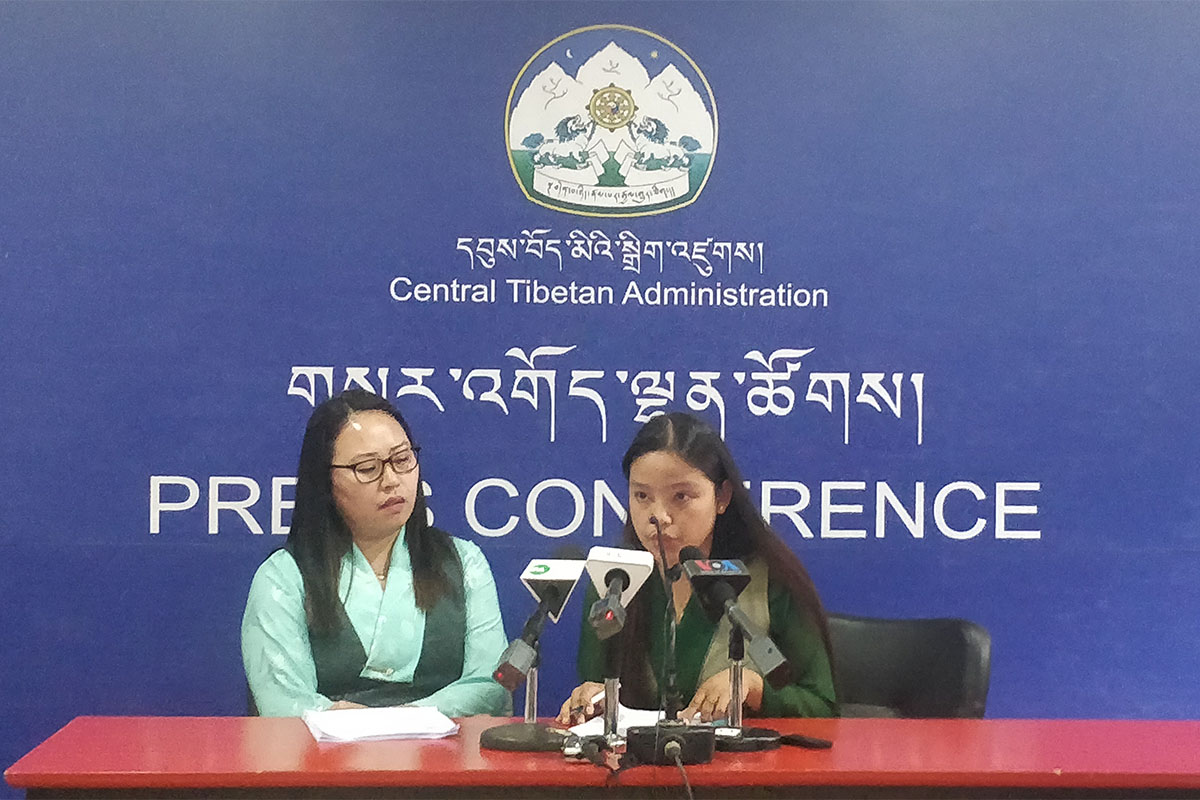 Staff members of Department of Information and International Relations Pema Tsering (left) and Sakina Batt present the 5-50 Forum document to the members of the press in Dharamshala, India, on 24 April 2019.