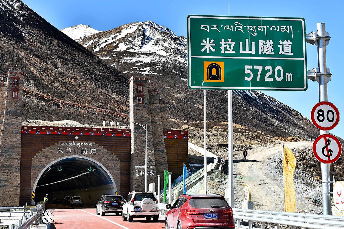 Cars run into the Mila Mountain tunnel, a part of the highway linking Lhasa with Nyingchi in the Tibet Autonomous Region.