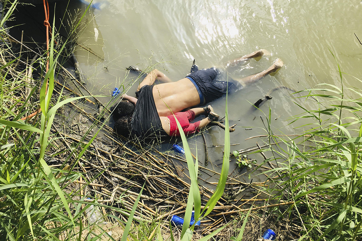 The bodies of Salvadoran migrant Oscar Alberto Martínez Ramírez and his nearly 2-year-old daughter Valeria lie on the bank of the Rio Grande in Matamoros, Mexico, on 24 June 2019, after they drowned trying to cross the river to Brownsville, Texas. Martinez' wife, Tania told Mexican authorities she watched her husband and child disappear in the strong current.