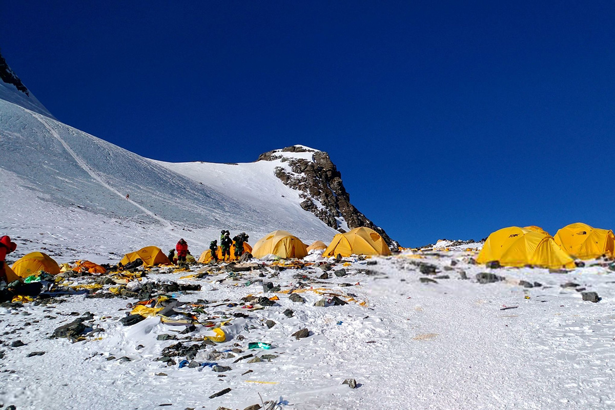 This picture taken on 21 May 2018 shows discarded climbing equipment and rubbish scattered around Camp 4 of Mount Everest. Decades of commercial mountaineering have turned Mount Everest into the world's highest rubbish dump as an increasing number of big-spending climbers pay little attention to the ugly footprint they leave behind.