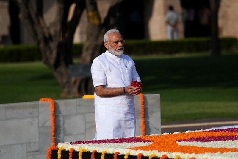 Indian Prime Minister Narendra Modi pays tribute at the memorial to slain independence leader Mahatma Gandhi before his inauguration for a second term.