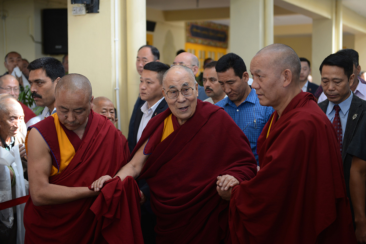 Tibetan spiritual leader the Dalai Lama (C) leaves after attending a conference on Kalachakra Tantra on the occasion of the 600th death anniversary of Lama Tsongkhapa, the founder of the Gelug sect of Tibetan Buddhism to which Dalai Lama belongs, at Tsuglakhang Temple in McLeod Ganj, India, on 5 May 2019.