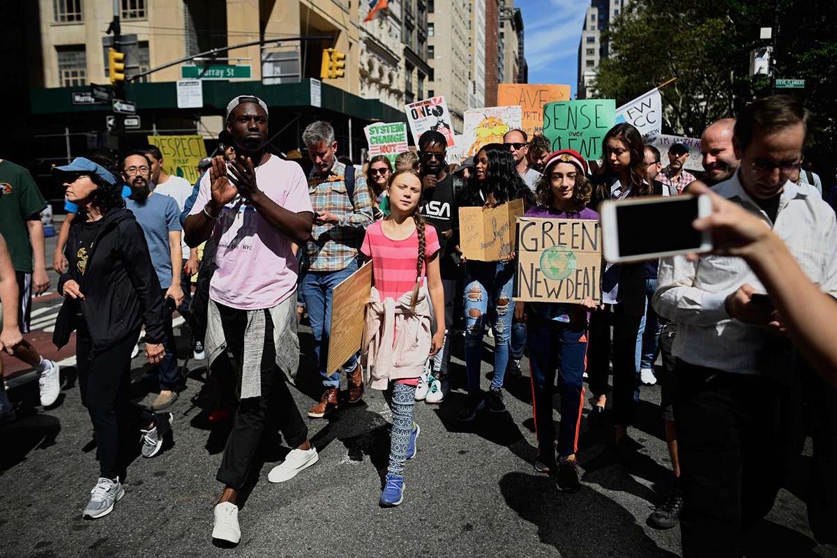 Teen activist Greta Thunberg walks during the Global Climate Strike march in New York City on 20 September 2019.