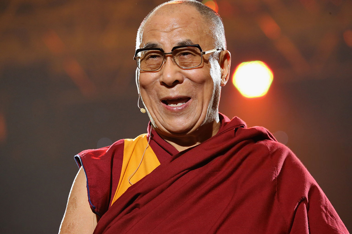 The Dalai Lama speaks at a concert at Syracuse University in 2012.