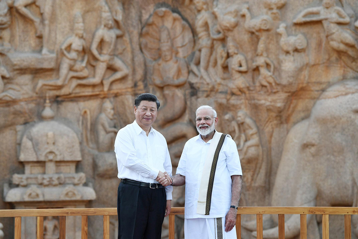China's President Xi Jinping shakes hand with India's Prime Minister Narendra Modi during their visit to Arjuna's Penance in Mamallapuram on the outskirts of Chennai, India, on 11 October 2019.